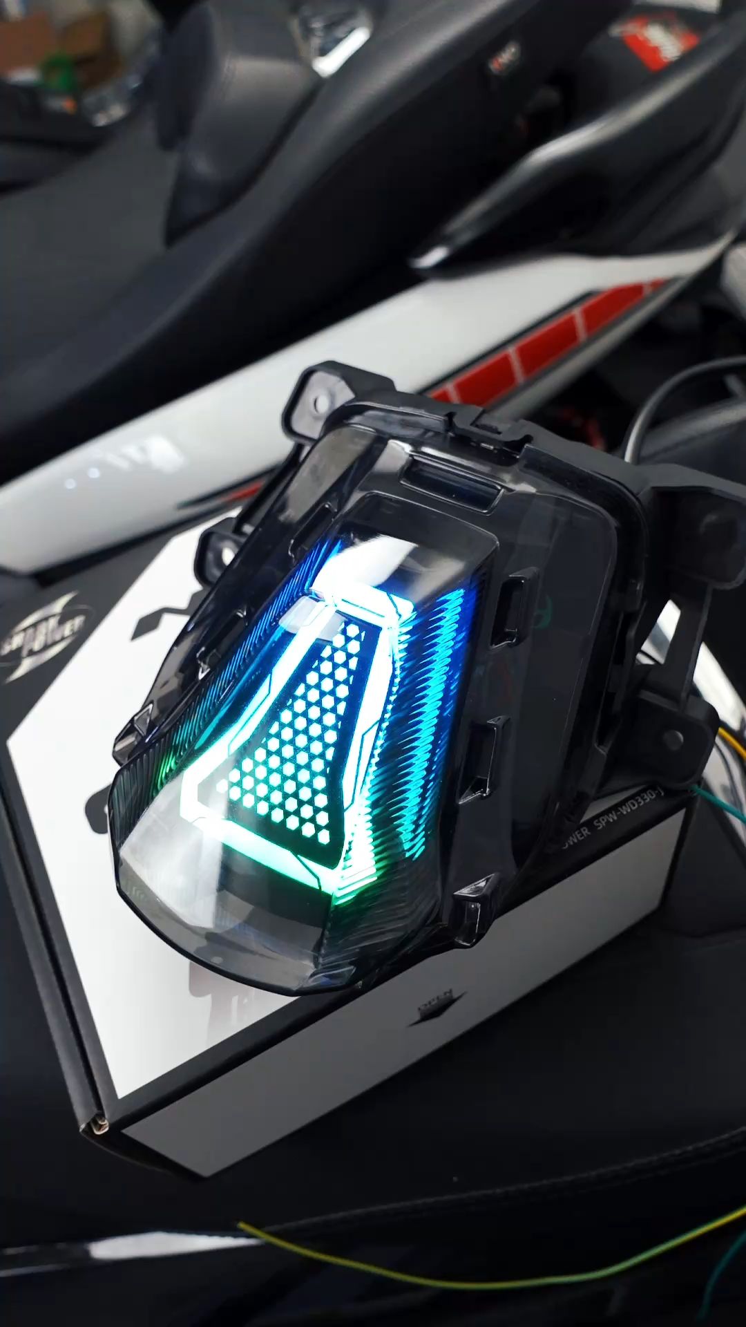 SharkPower RGB Tail Light for Aerox V3 77 RGB modes. App + dual mini switch control. Street-legal. Plug & play. Upgrade your Aerox V3 (2025+)